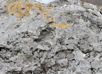 Fototapeta premium Foot soil - limestone material of volcanic origin, mountainous terrain, close-up.