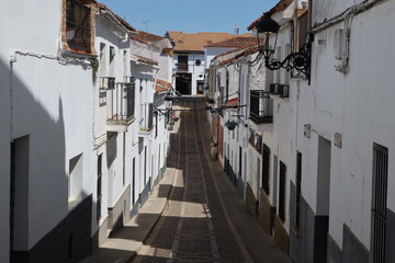 Jabugo, Huelva, Spain, April 13, 2023: A cobbled street in the town of Jabugo, Huelva, Spain