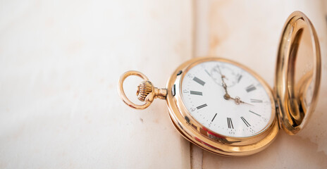 vintage gold pocket watch longines isolated on white background