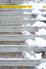 Half of the Stairs Have been cleared from the snow while the other half is still covered by snow