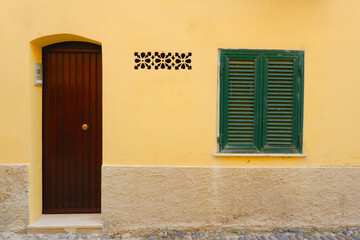 Simple rustic entrance of the old house in Alghero, Sardinia, Italy