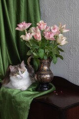 Adorable cat and bouquet of flowers