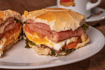 
French bread with egg, cheese, tomato, lettuce and smoked mortadella