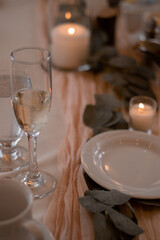 Boho style table setting with blush pink and beige linen
