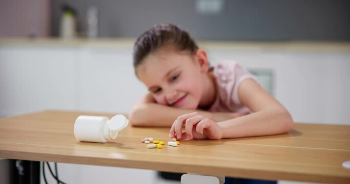 Child Reaching Medicine. Domestic Kid Accident