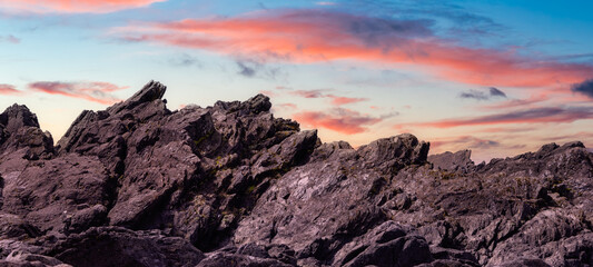 Rugged Rocks on the West Coast of Pacific Ocean. Sunrise Sky Art Render. Ucluelet, Vancouver Island, British Columbia, Canada. Nature Background