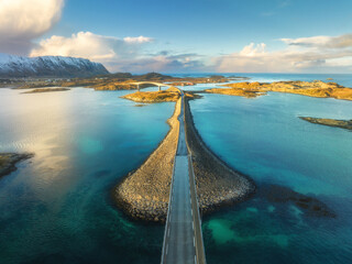 Aerial view of bridge over the sea and snowy mountains in Lofoten Islands, Norway. Fredvang bridges...