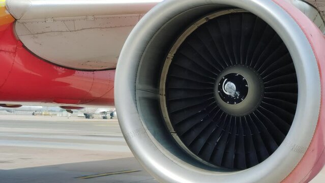 Jet engine of aircraft rotates. Aviation industry concept, inspection and maintenance of aircraft engines.