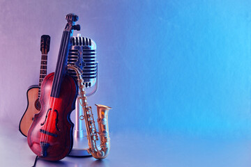 International Jazz Day or World Music day background. Musical instruments on blue background