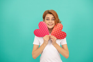 glad young lady with red heart on blue background