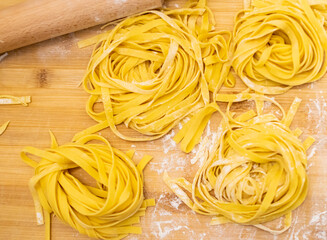 Close up of Pasta and Hands making home made Italian Pasta