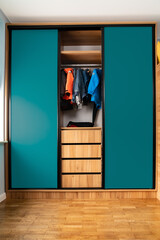 Sleep and play in a kids room with stylish wooden bunk beds and bright blue-green accents