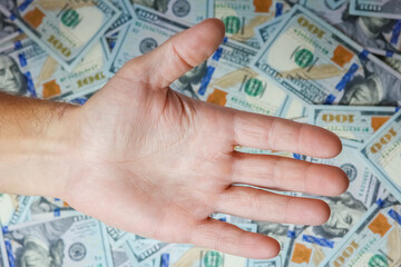 A hands with dollars on the background of money concept of business banknotes in the bank