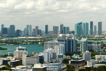Aerial view of downtown office district of Miami in Florida, USA on bright sunny day. High commercial and residential skyscraper buildings in modern american megapolis