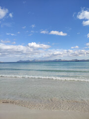 Fototapeta na wymiar sand beach and blue sky with calm sea