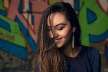 Naklejka premium Portrait of a beautiful woman with long hair looking down