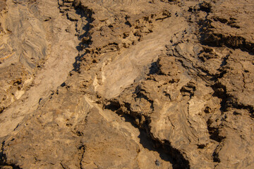 Sand texture from the flow of spring water near a lake in the Canadian forest
