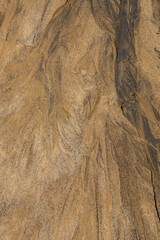 Sand texture from the flow of spring water near a lake in the Canadian forest