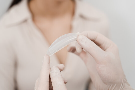 Nasal splints are installed in the nose during septoplasty to correct the deformity of nasal septum. ENT doctor is holding airway nasal splints two pieces of plastic held inside nose.