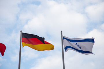 Germany and Israel flags waving in the win