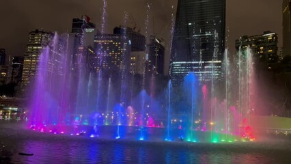 fountain show at night with colorful lights - celebration theme