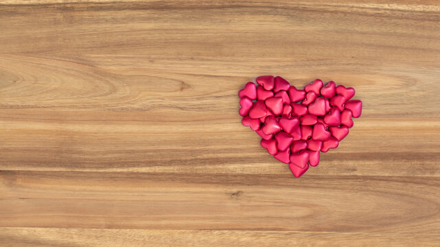 Wood texture with natural wood pattern and heart shape. Love concept. Brown wood background with space for text or image.