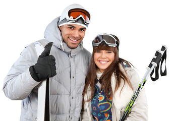 Happy young skiers couple embracing and holding sticks and skis isolated on white