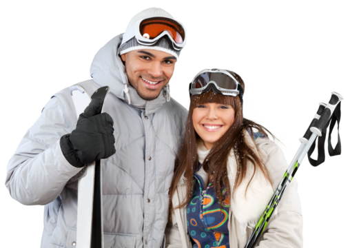 Happy young skiers couple embracing and holding sticks and skis isolated on white
