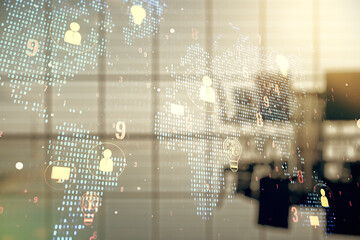Double exposure of social network icons interface and world map on a modern boardroom background. Networking concept