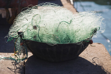 Fishing nets for catching fish in the sea and ocean. Fishing networks thrown in the harbor. Fishing...