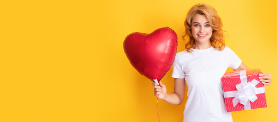 happy redhead girl with love heart balloon and box. happy valentines day. Beauty woman isolated face portrait, banner with mock up copy space.