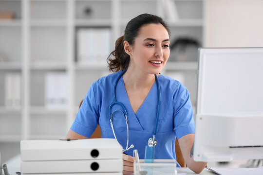Female medical assistant at workplace in clinic