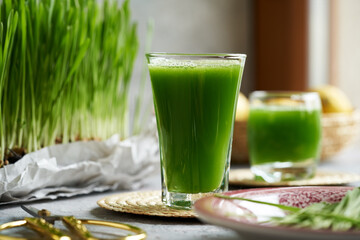 Green barley grass juice in a glass