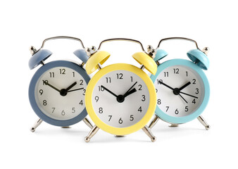 Set of alarm clocks on white background