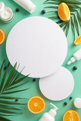 Summer stylish fruit skincare concept. Top view flat lay of mock up cream bottles, jars, serum, pipette with orange on teal background. Empty circles for text or advert