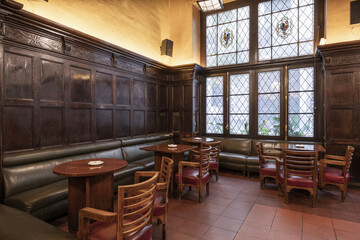 An old British style pub cafe lounge with paneled walls