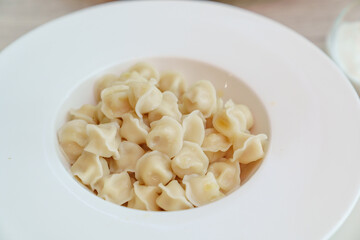 small baby dumplings in a white deep plate. the children's menu.