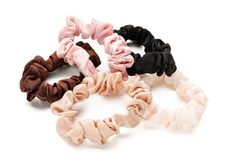 Set of stylish scrunchies on white background