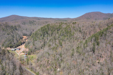 wooded land in mountains aerial