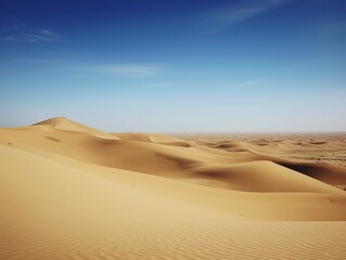 Fototapeta na wymiar Desert sand dunes and blue sky