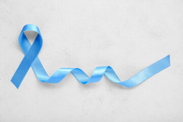 Blue awareness ribbon on white background. Diabetes concept