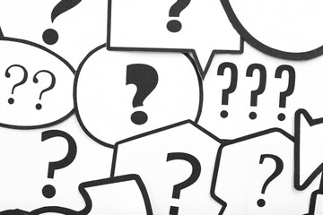 Speech bubbles with question marks, closeup