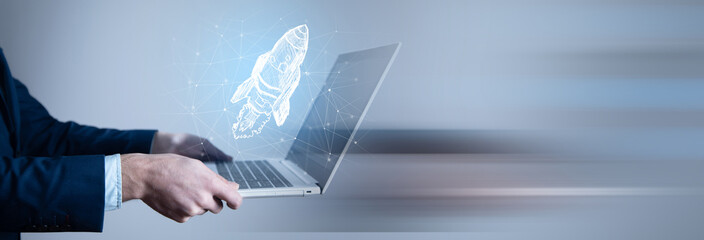 Startup business concept, Businessman holding icon transparent rocket