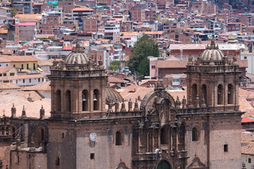 Cusco cathedral dome exterior view with historic building background in Plaza de Armas Cusco.  Selective focus. 