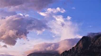 Mountain with big purple clouds panoramic scenery