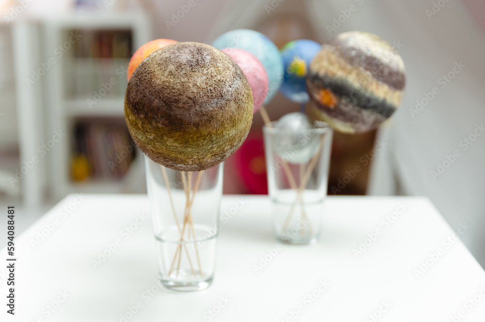 Wall mural styrofoam balls are painted with paints in the solar system. homework solar system. space planets