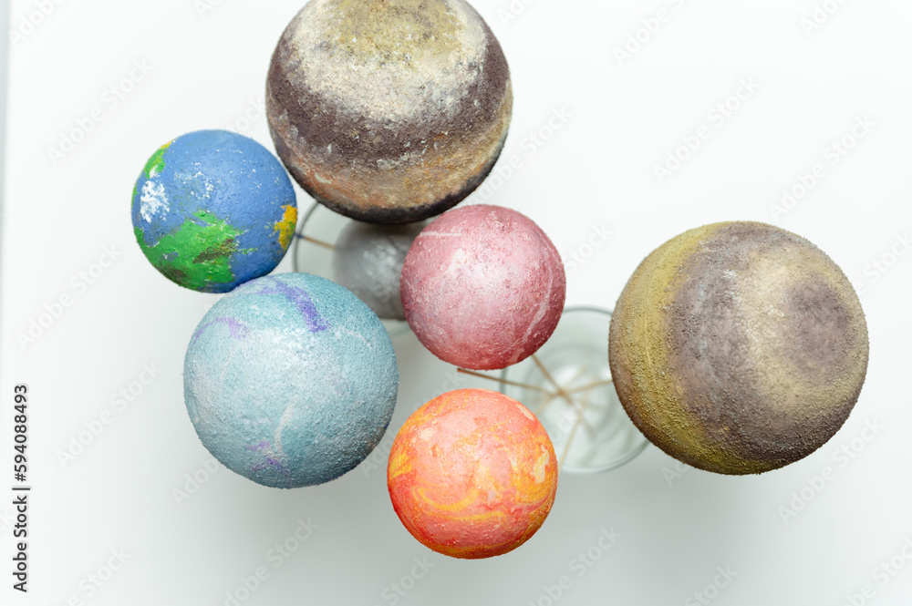 Wall mural styrofoam balls are painted with paints in the solar system. homework solar system. space planets