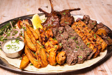 Assorted mix grills with chicken tikka, beef kabab, mutton kebab, wings, boti, malai, chop, shish...