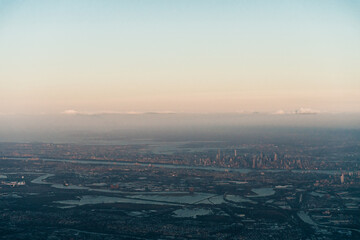 view of new york and new jersey from the plane on sunset