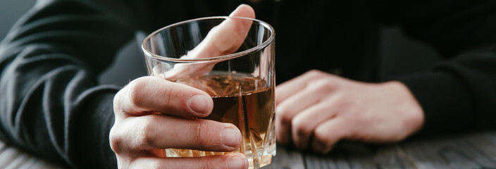 businessmen holding a glass of whiskey